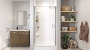 Modern bathroom featuring a Bath Fitter white acrylic shower enclosure with built-in corner shelving and sliding glass door, flanked by a wood vanity with chrome sconce lighting on the left and open wood shelving with folded towels and plants on the right