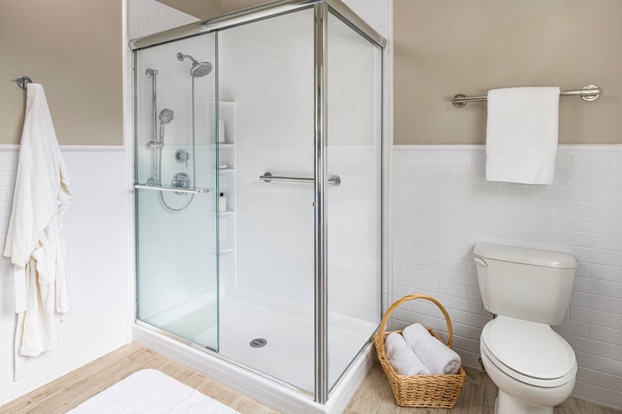 Updated shower with modern fixtures and wall surround